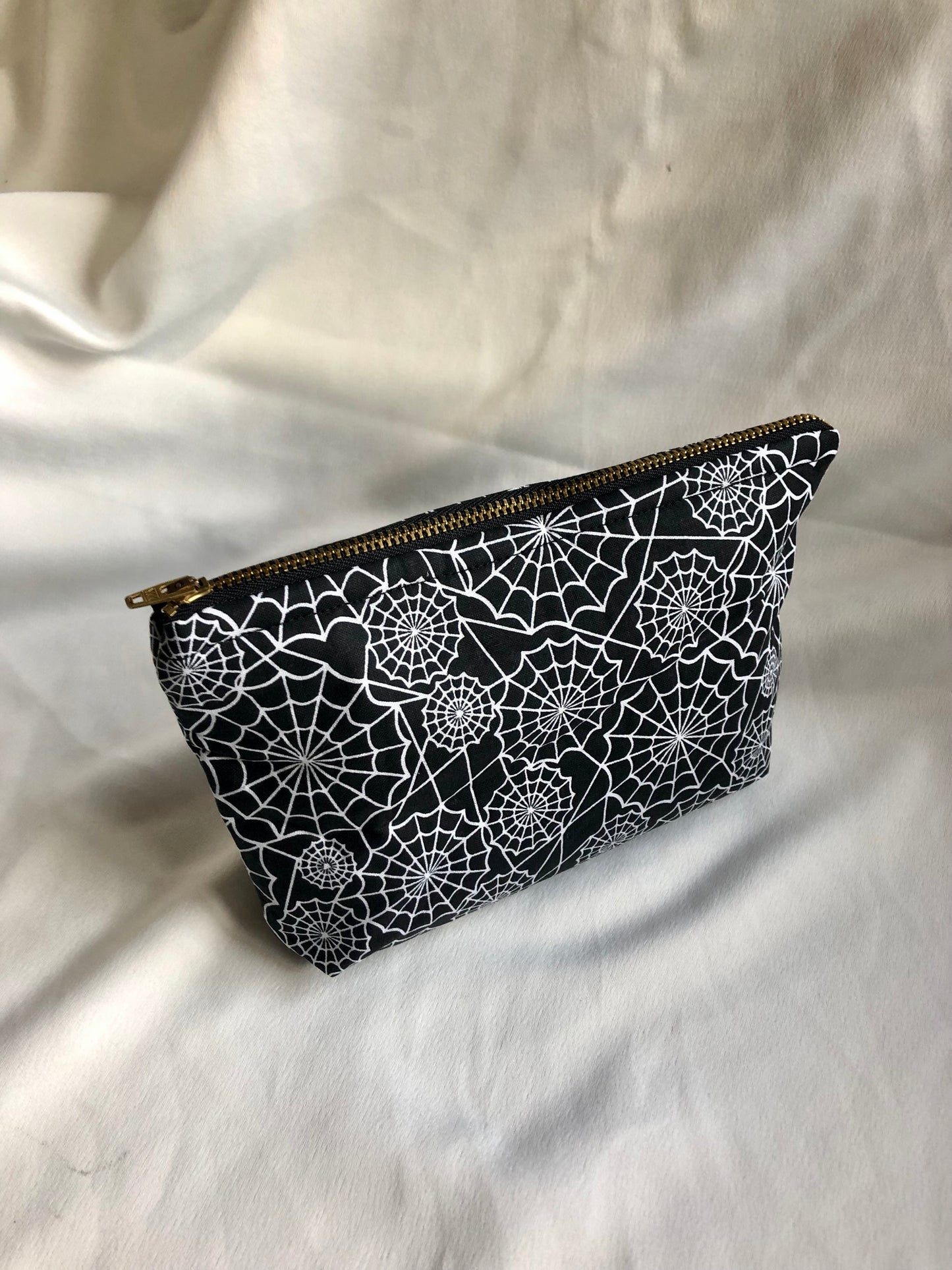 Black with white spiderwebs zipped pouch/make up bag