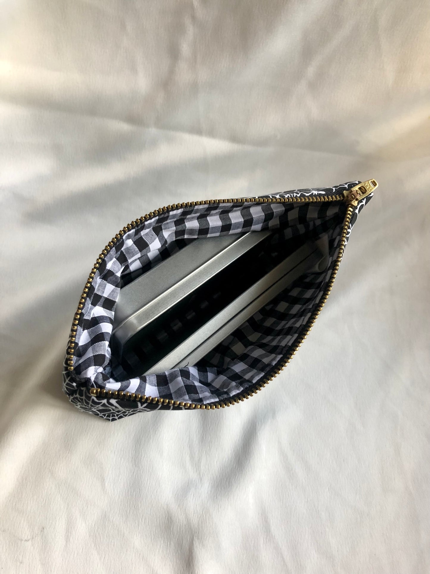 Black with white spiderwebs zipped pouch/make up bag